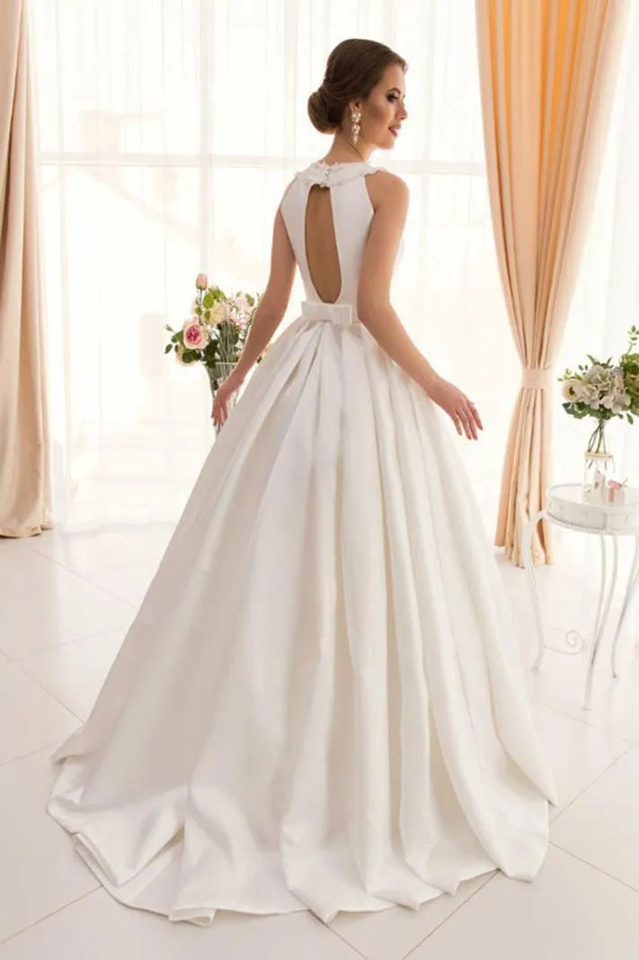 ---Classic style A line duchess satin wedding dress with wide, pleated skirt featuring a small train, stiff bodice with padded c