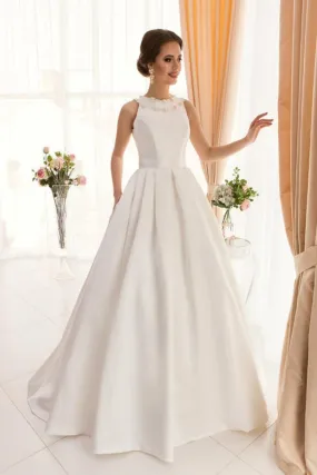 ---Classic style A line duchess satin wedding dress with wide, pleated skirt featuring a small train, stiff bodice with padded c