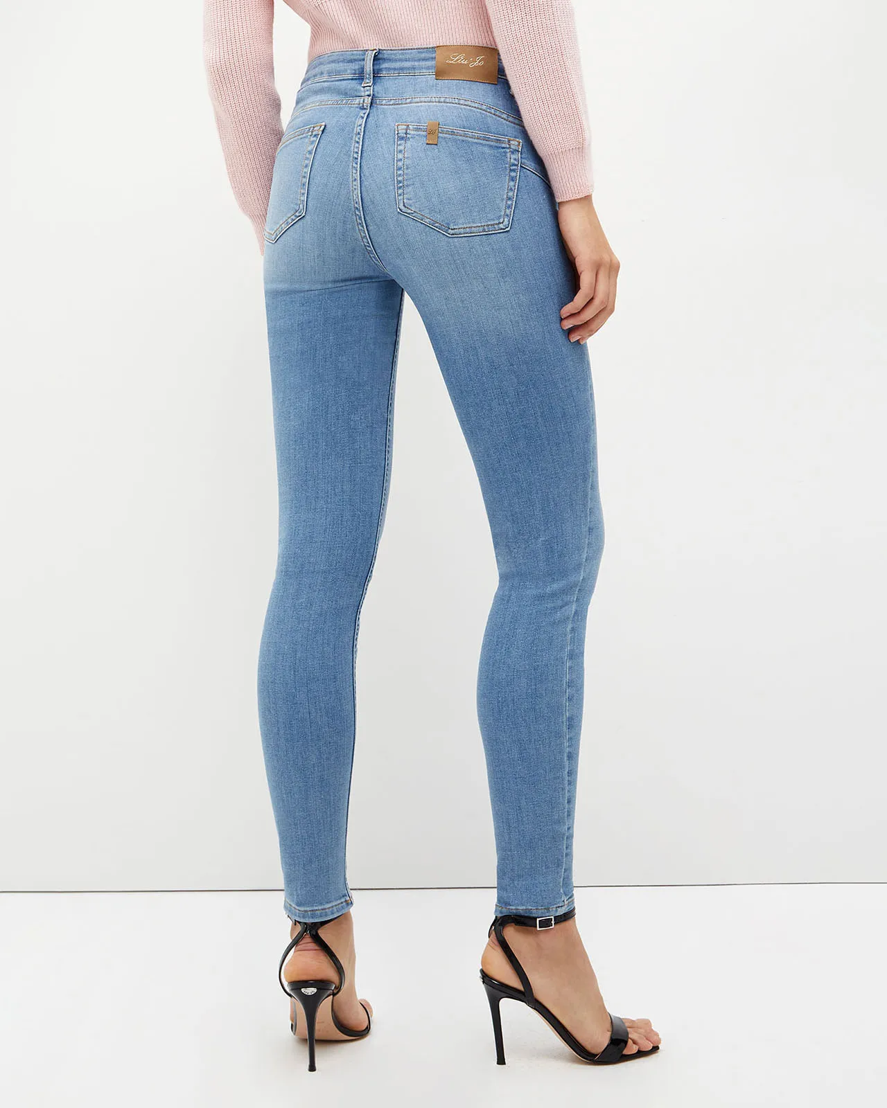 Jeans skinny bottom up a vita alta in cotone strech lavaggio chiaro super stone washed